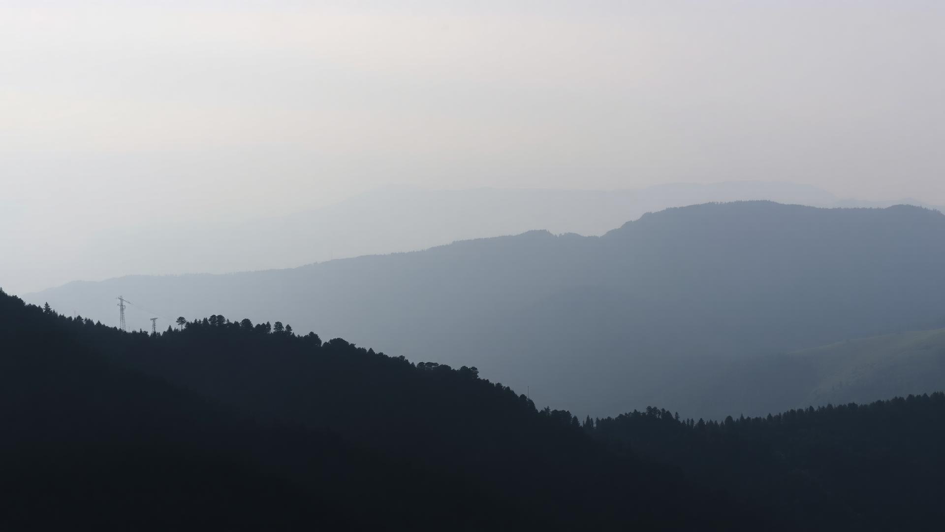 Misty mountain ridges at dawn